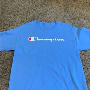 This is a baby blue champion t shirt size Medium